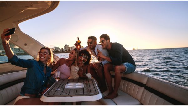 Friends taking selfie on boat