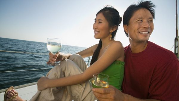 Couple drinking wine on boat