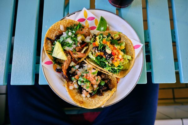 plate of tacos on blue table